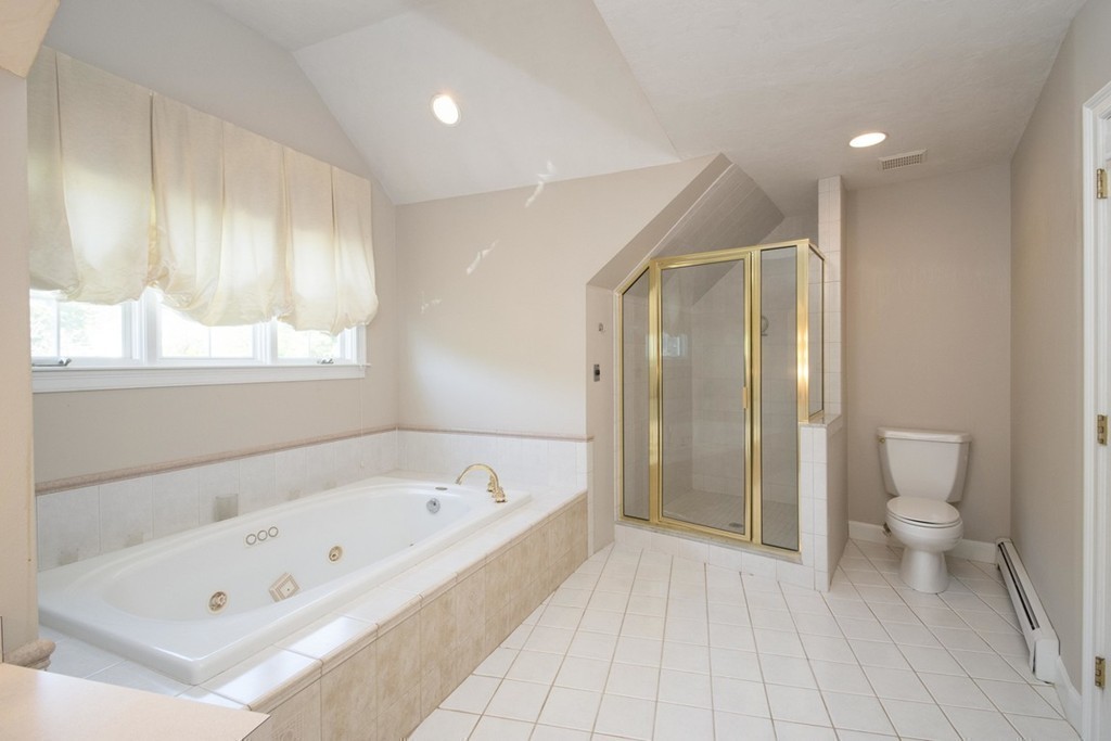 77 High Pines Drive Kingston, MA 02364 - Photo 17 of 28 a bathroom with a bathtub and a toilet