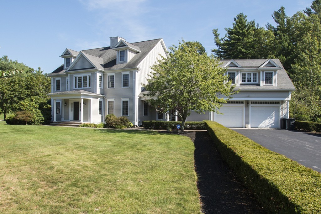 77 High Pines Drive Kingston, MA 02364 - Photo 2 of 28 a front view of a house with a yard