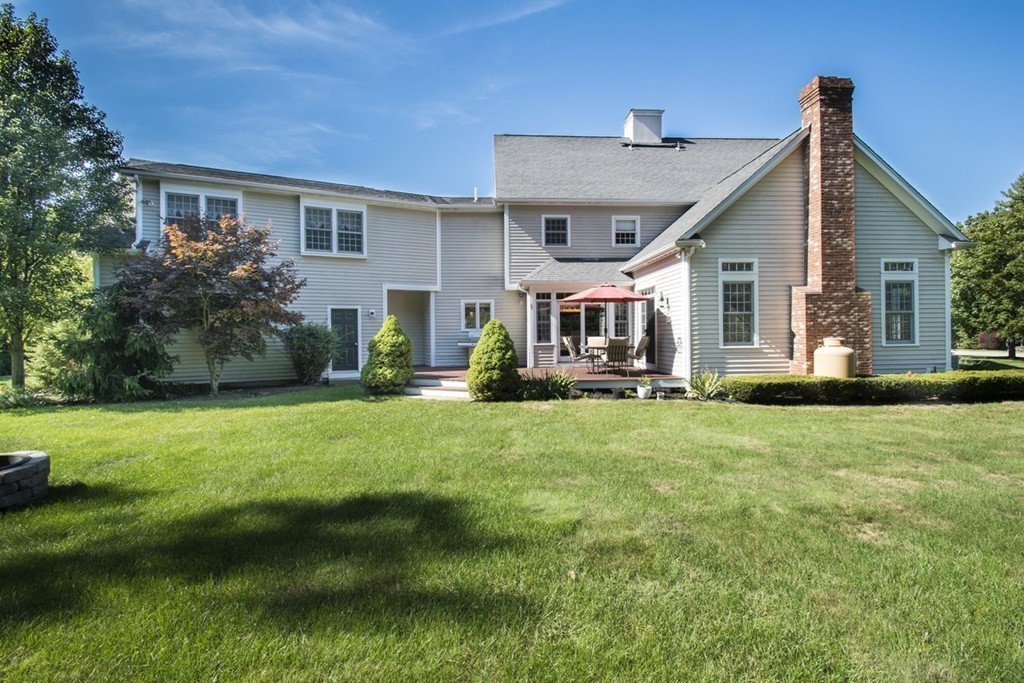 77 High Pines Drive Kingston, MA 02364 - Photo 23 of 28 a front view of house with yard and green space