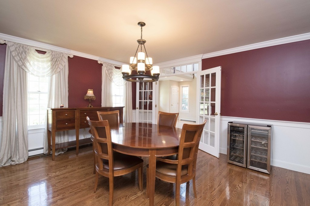 77 High Pines Drive Kingston, MA 02364 - Photo 9 of 28 a view of a dining room with furniture wooden floor and chandelier