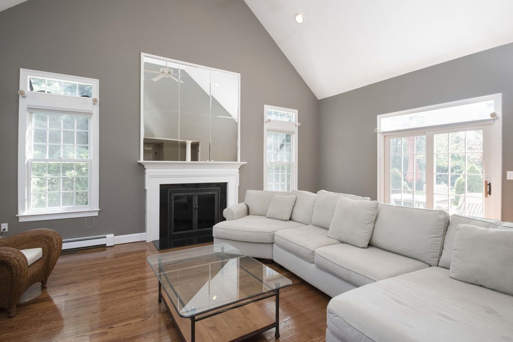 77 High Pines Drive Kingston, MA 02364 - Photo 10 of 28 a living room with furniture a fireplace and a large window