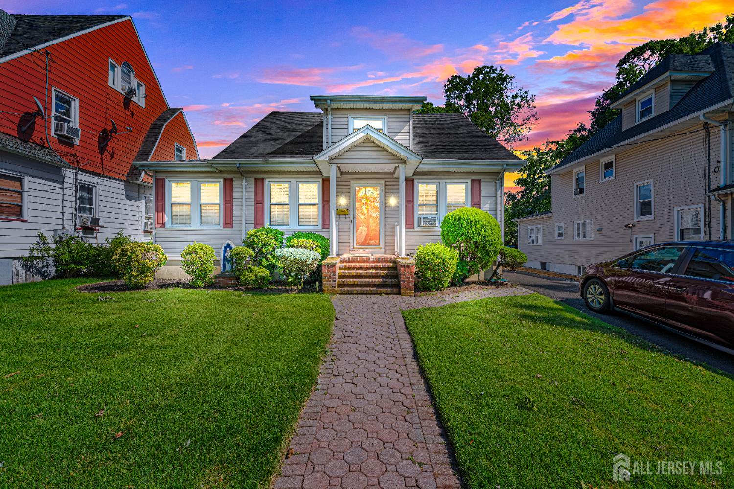 a front view of a house with garden