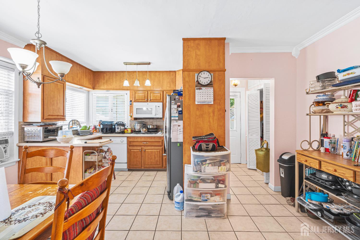 305 Penfield Place Dunellen, NJ 08812 - Photo 12 of 53 a kitchen with stainless steel appliances a stove a sink and cabinets