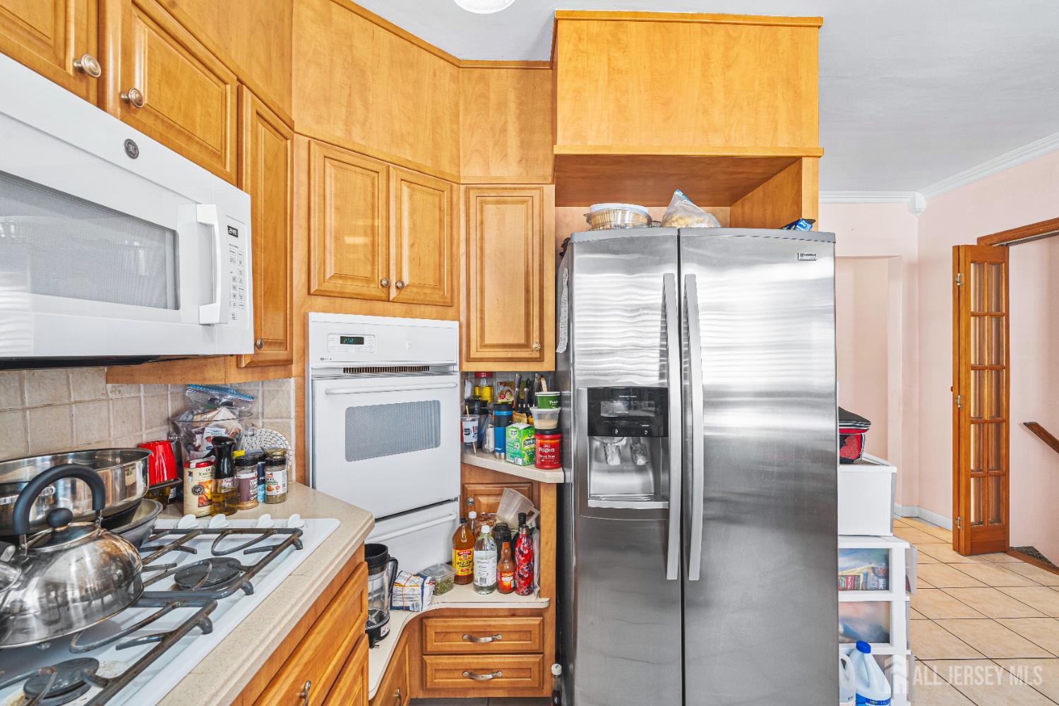 305 Penfield Place Dunellen, NJ 08812 - Photo 14 of 53 a kitchen with a refrigerator and a stove top oven