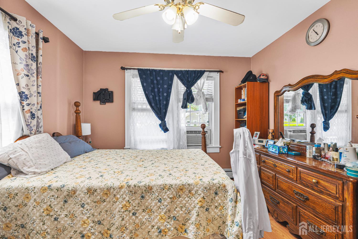 305 Penfield Place Dunellen, NJ 08812 - Photo 15 of 53 a bedroom with a bed and a chandelier