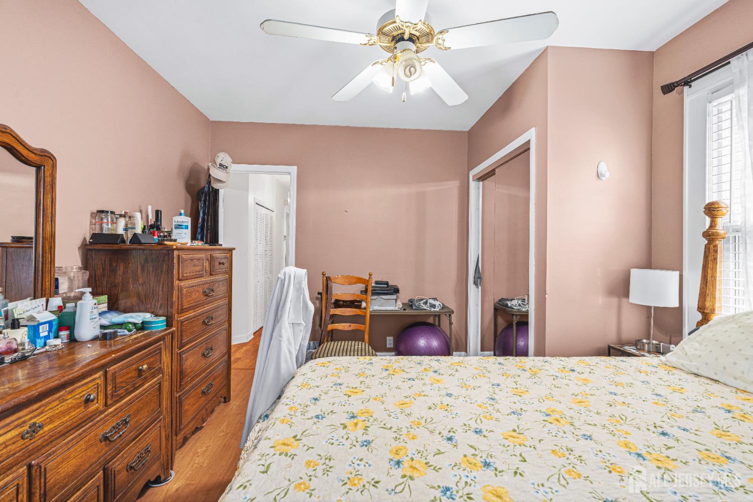 305 Penfield Place Dunellen, NJ 08812 - Photo 16 of 53 a bedroom with a bed and dresser with mirror