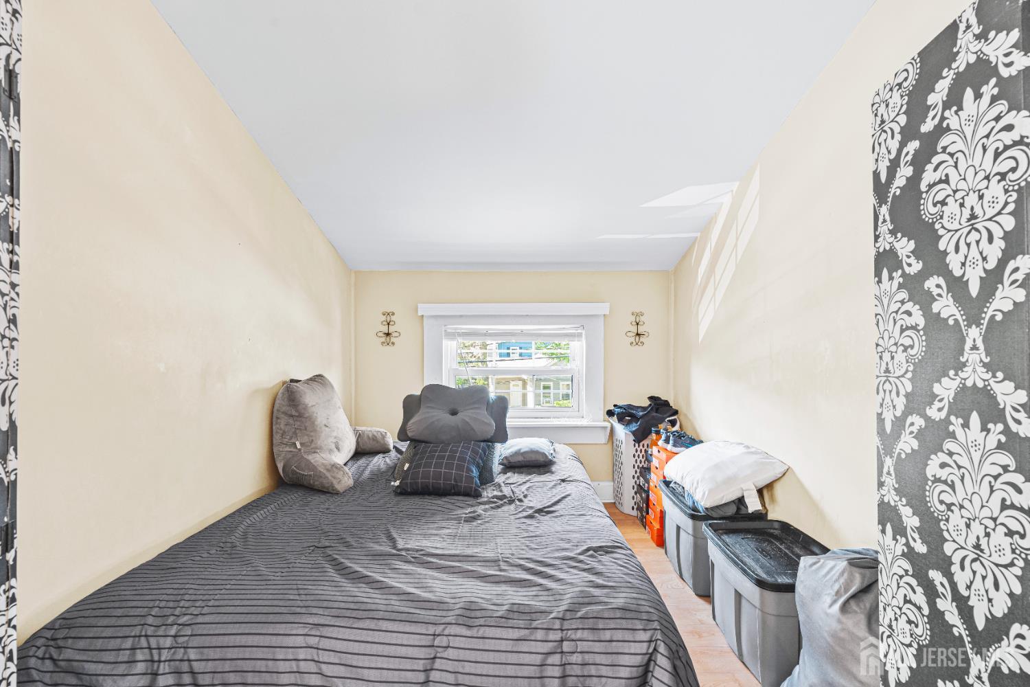 305 Penfield Place Dunellen, NJ 08812 - Photo 19 of 53 a bedroom with furniture and a window
