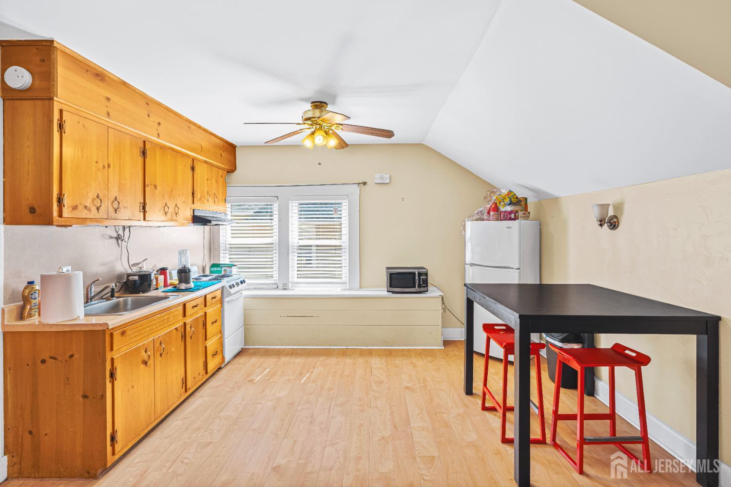 305 Penfield Place Dunellen, NJ 08812 - Photo 25 of 53 a kitchen that has a lot of cabinets appliances and a window
