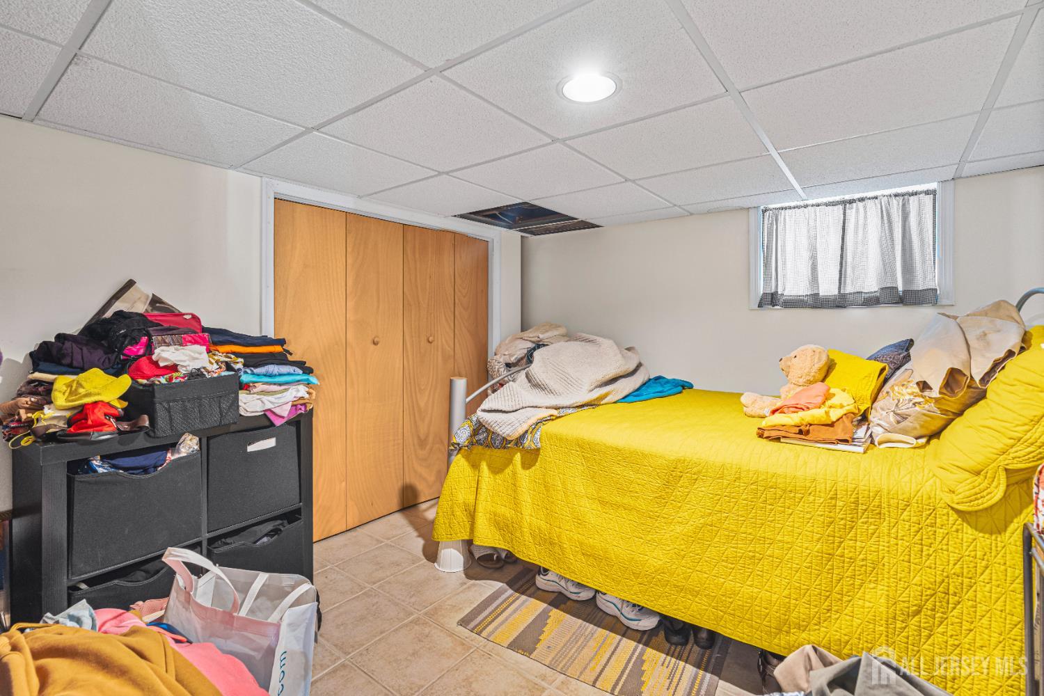 305 Penfield Place Dunellen, NJ 08812 - Photo 34 of 53 a bedroom with a bed and ceiling fan