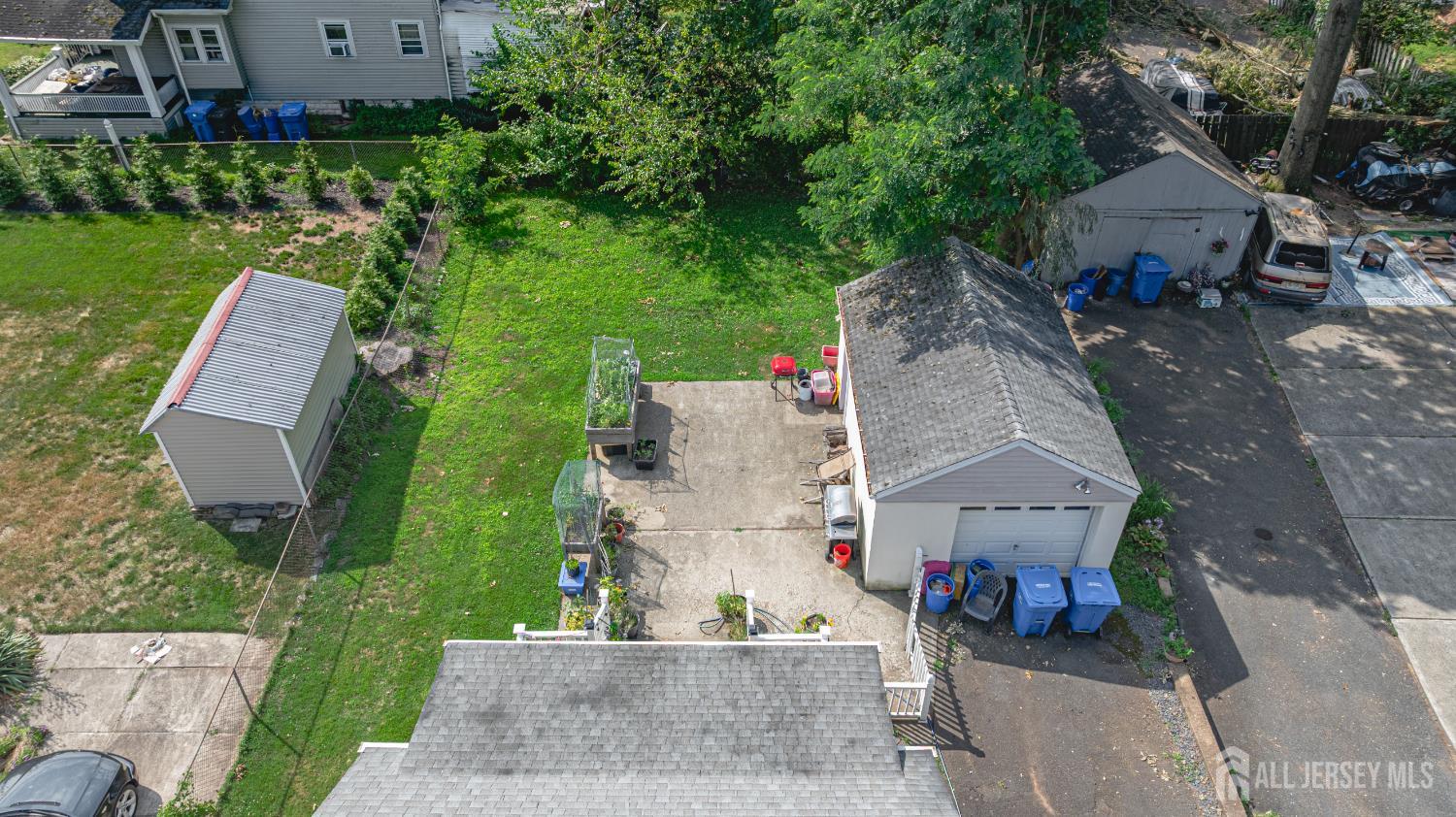 305 Penfield Place Dunellen, NJ 08812 - Photo 42 of 53 an aerial view of a house with garden space and street view