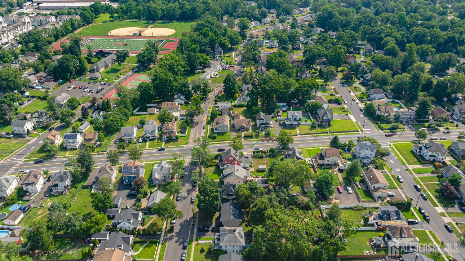 305 Penfield Place Dunellen, NJ 08812 - Photo 51 of 53 a view of a multi story building with a yard
