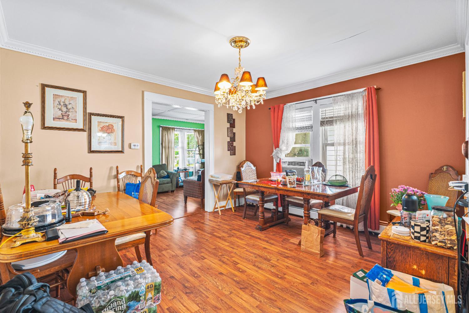 305 Penfield Place Dunellen, NJ 08812 - Photo 8 of 53 a living room with furniture a rug and a chandelier