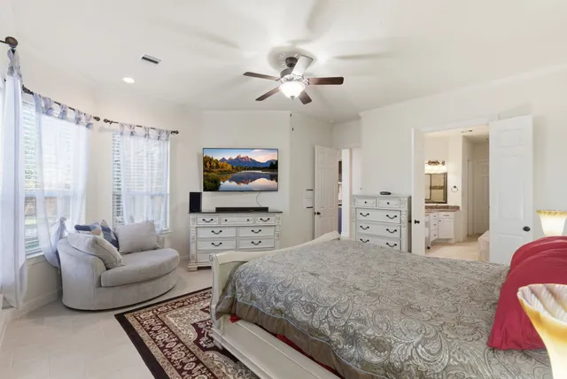 a bathroom with a granite countertop sink mirror and bathtub