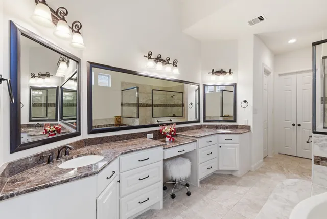a kitchen with a sink and cabinets