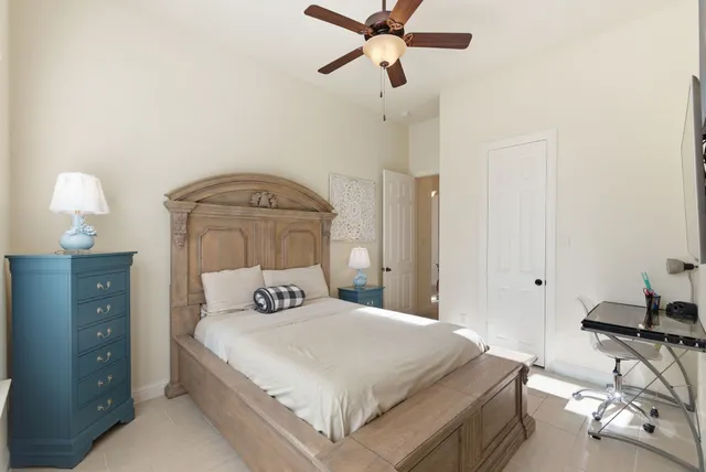 a bedroom with a bed and a chair