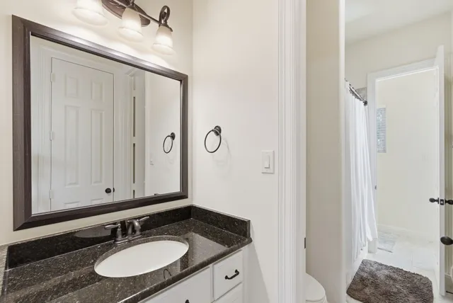 a view of a patio with a table and chairs