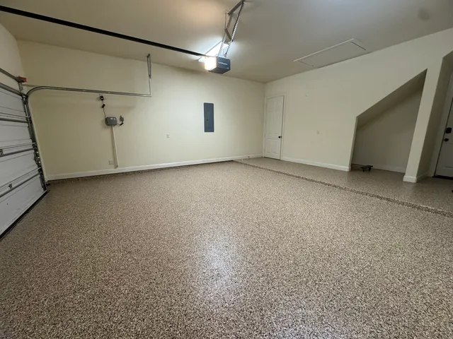 an aerial view of a house with garden space and street view