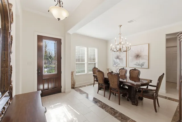 a view of a dining room with furniture window and outside view