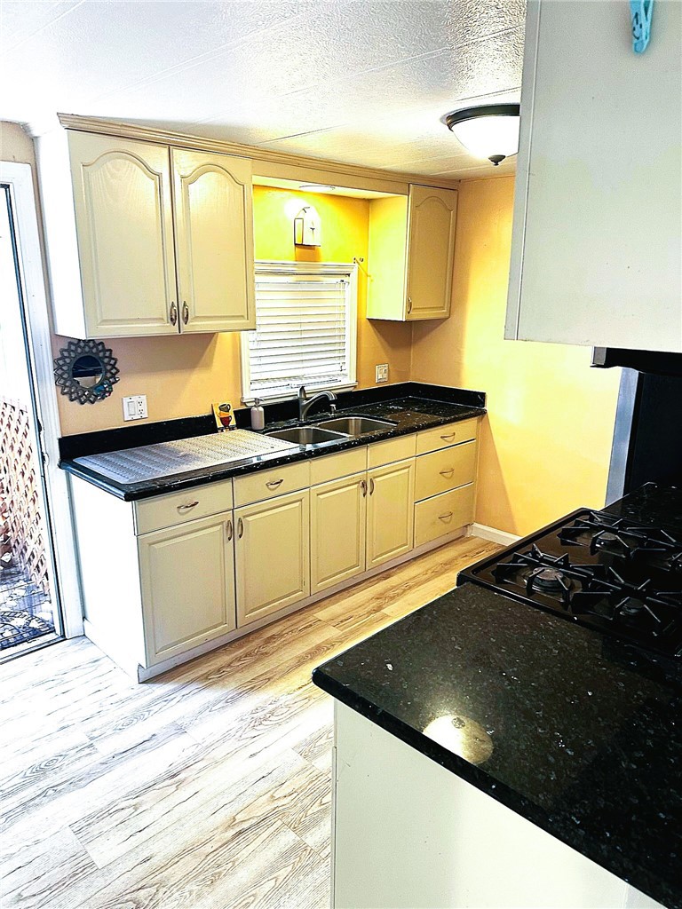 503 Corte Naranja, Unit 503 Rohnert Park, CA 94928 - Photo 15 of 16 a kitchen with stainless steel appliances granite countertop a sink stove and cabinets