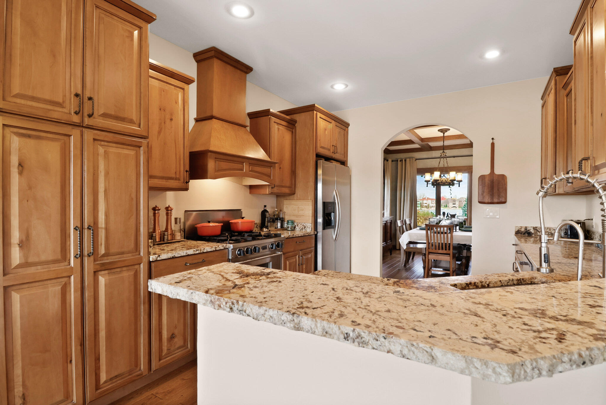 10380 Doubletree Drive South Crown Point, IN 46307 - Photo 19 of 80 a kitchen with stainless steel appliances granite countertop a refrigerator and a sink