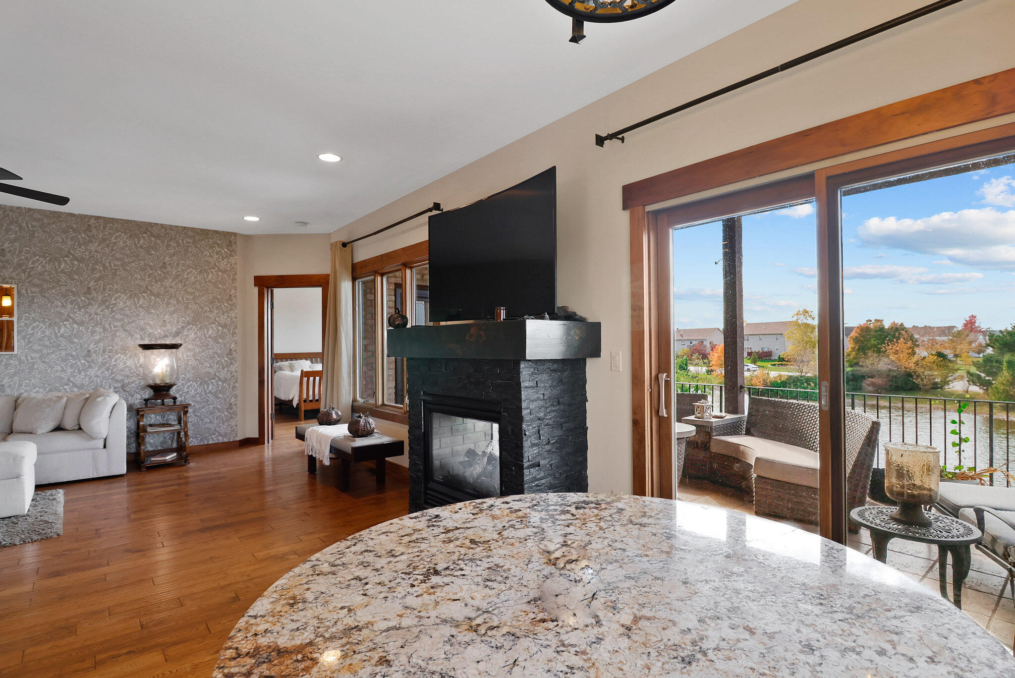 10380 Doubletree Drive South Crown Point, IN 46307 - Photo 21 of 80 a living room with fireplace furniture and a flat screen tv