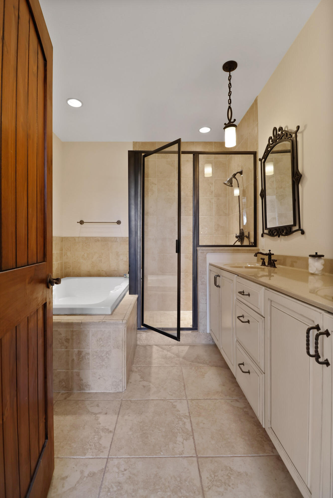 10380 Doubletree Drive South Crown Point, IN 46307 - Photo 28 of 80 a spacious bathroom with a double vanity sink a mirror and a bathtub