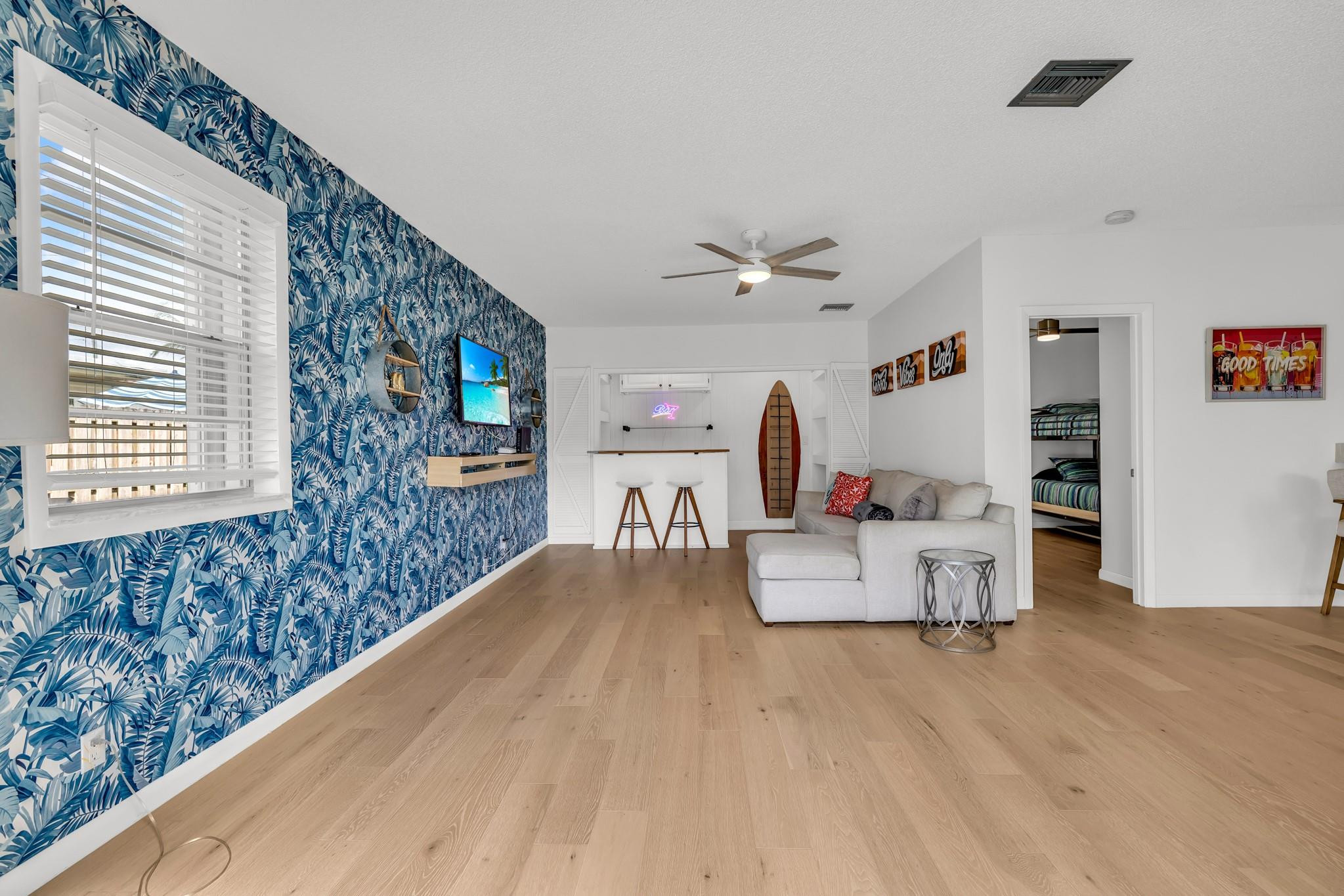 5211 Northeast 26th Avenue Lighthouse Point, FL 33064 - Photo 13 of 33 a living room with furniture and wooden floor