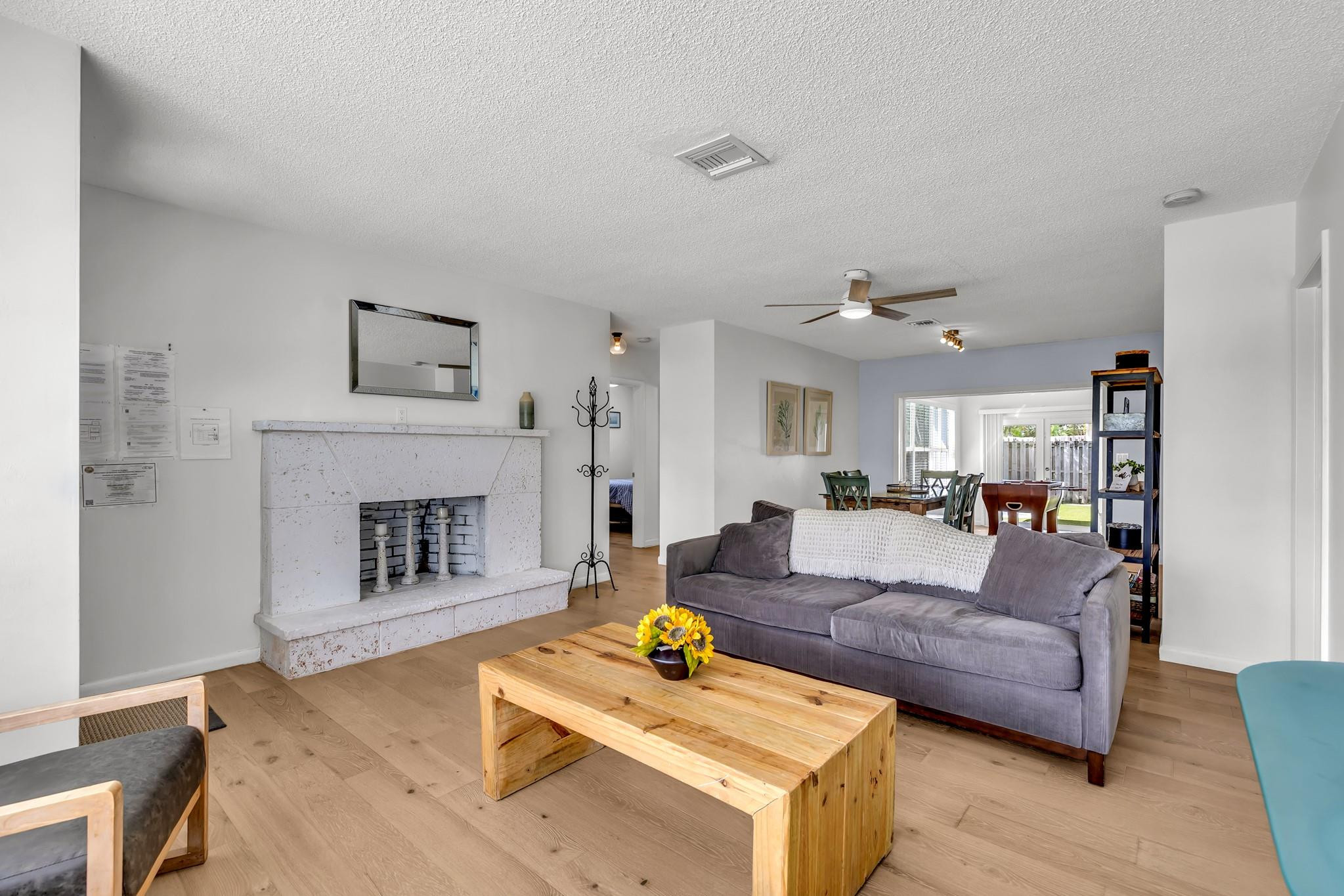 5211 Northeast 26th Avenue Lighthouse Point, FL 33064 - Photo 18 of 33 a living room with furniture and a fireplace