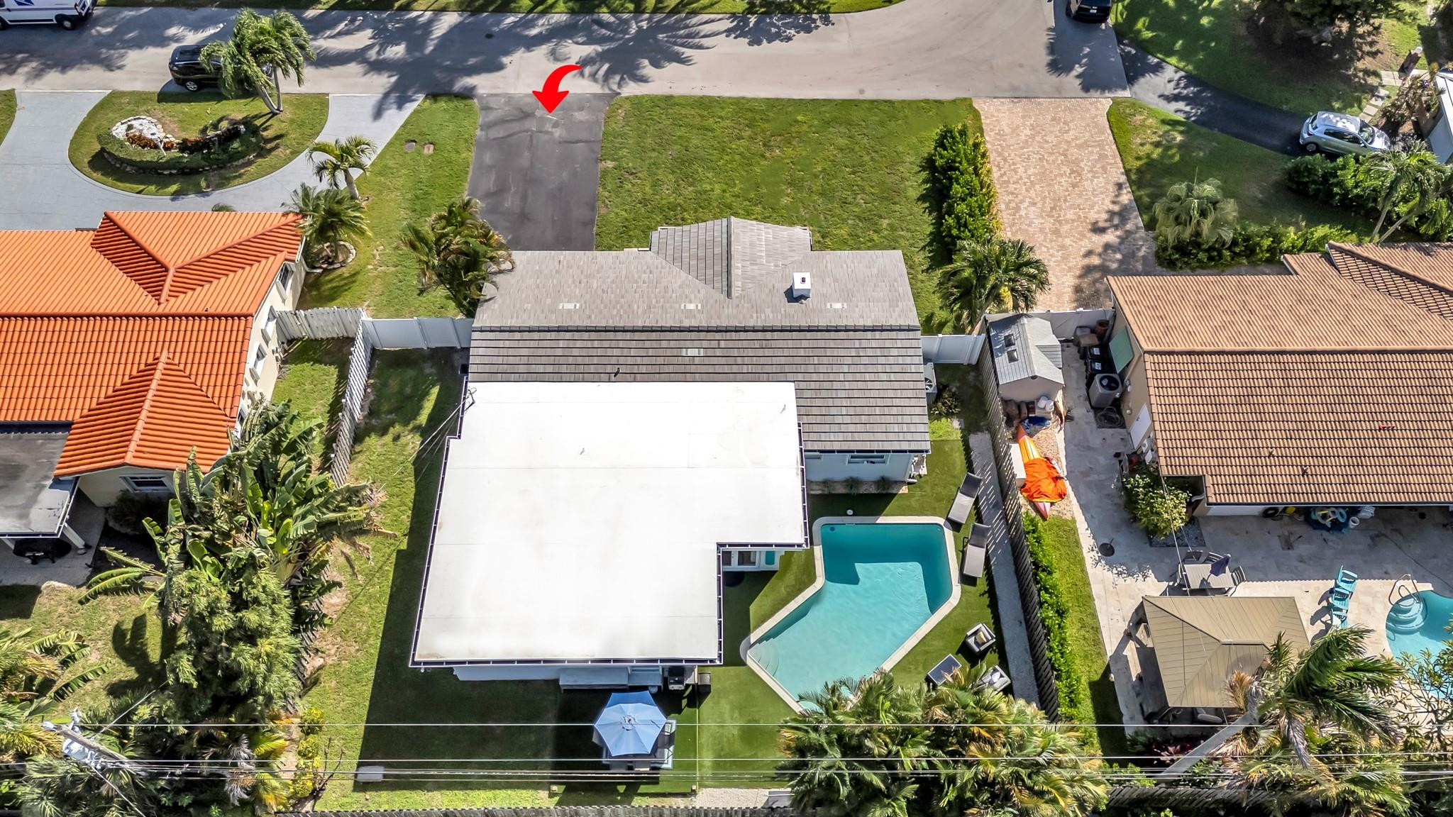 5211 Northeast 26th Avenue Lighthouse Point, FL 33064 - Photo 2 of 33 an aerial view of a house with a swimming pool