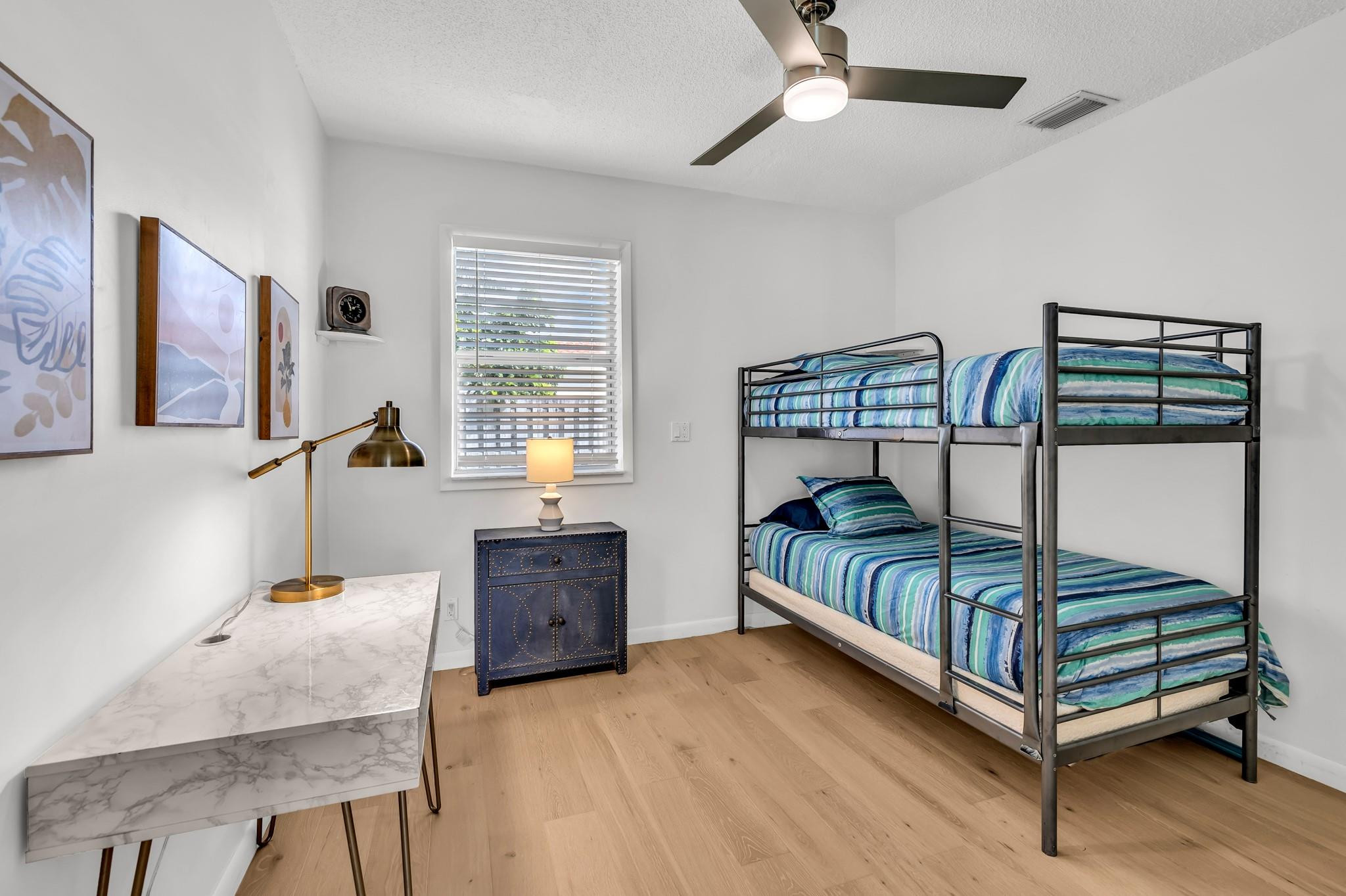 5211 Northeast 26th Avenue Lighthouse Point, FL 33064 - Photo 26 of 33 a bedroom with furniture and a window
