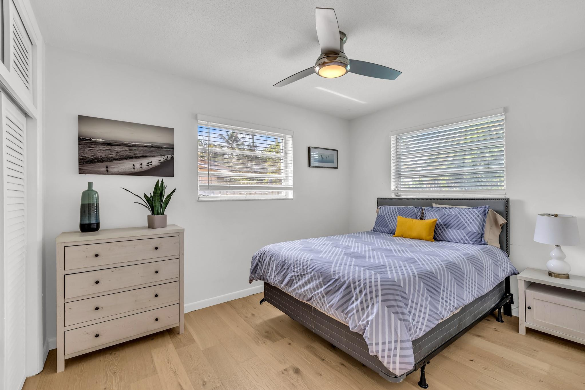 5211 Northeast 26th Avenue Lighthouse Point, FL 33064 - Photo 32 of 33 a bedroom with a bed and window