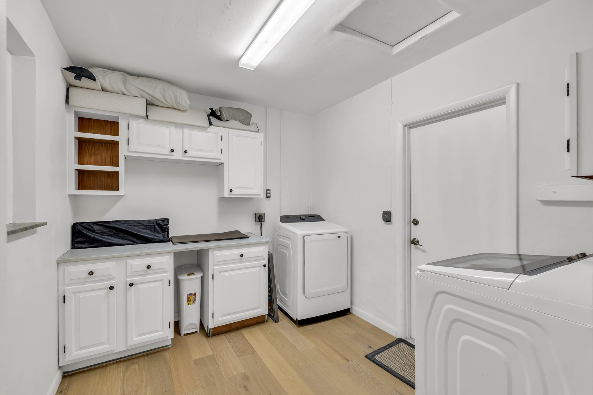 5211 Northeast 26th Avenue Lighthouse Point, FL 33064 - Photo 33 of 33 a kitchen with cabinets a washer and dryer