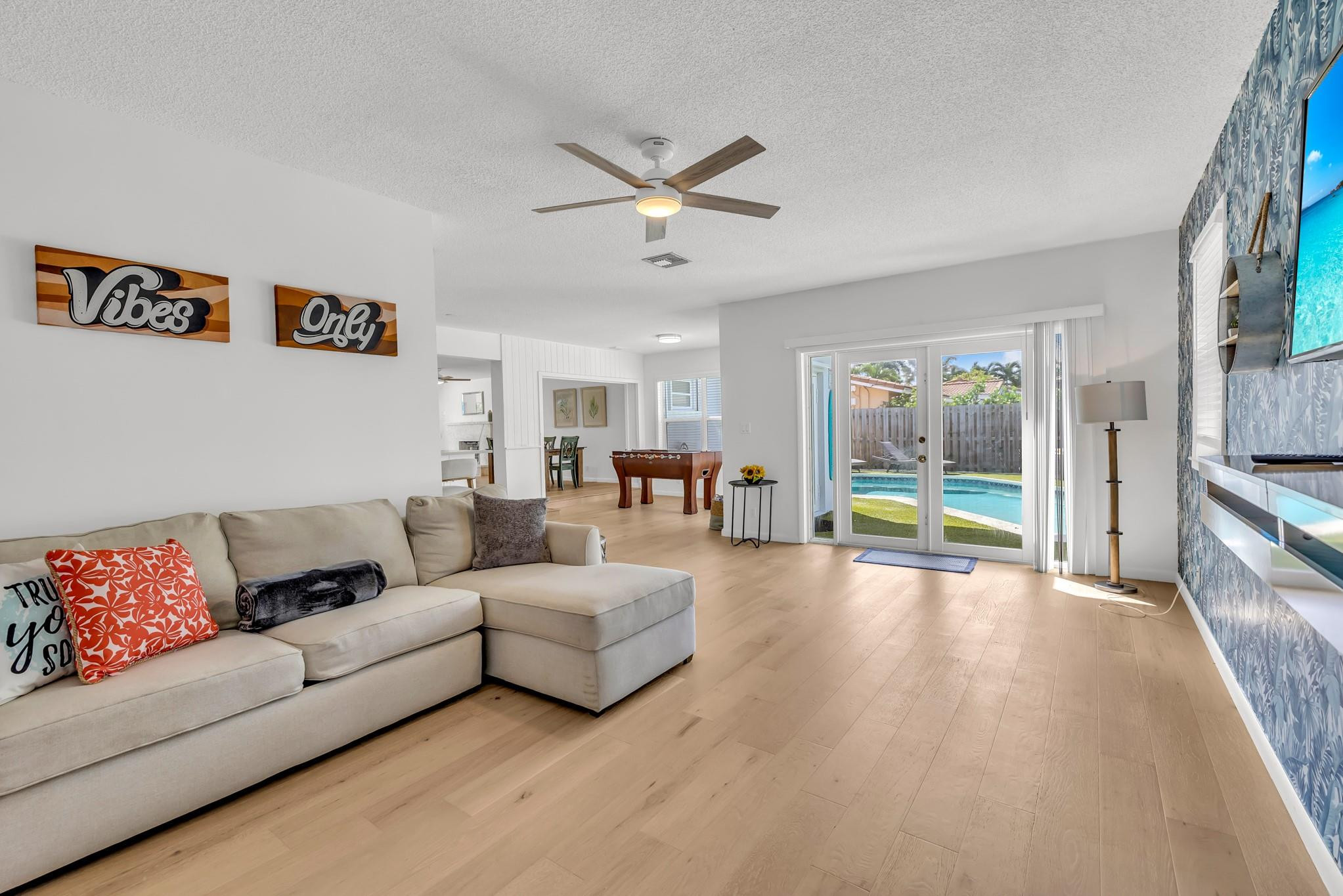 5211 Northeast 26th Avenue Lighthouse Point, FL 33064 - Photo 5 of 33 a living room with furniture and a large window