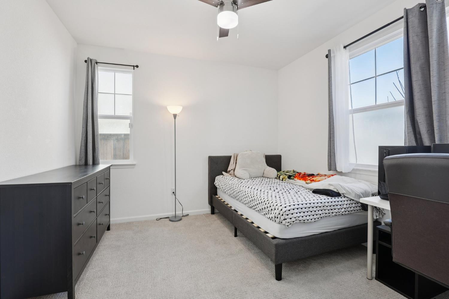 2413 Seaside Road Lathrop, CA 95330 - Photo 16 of 37 a bedroom with a bed and window