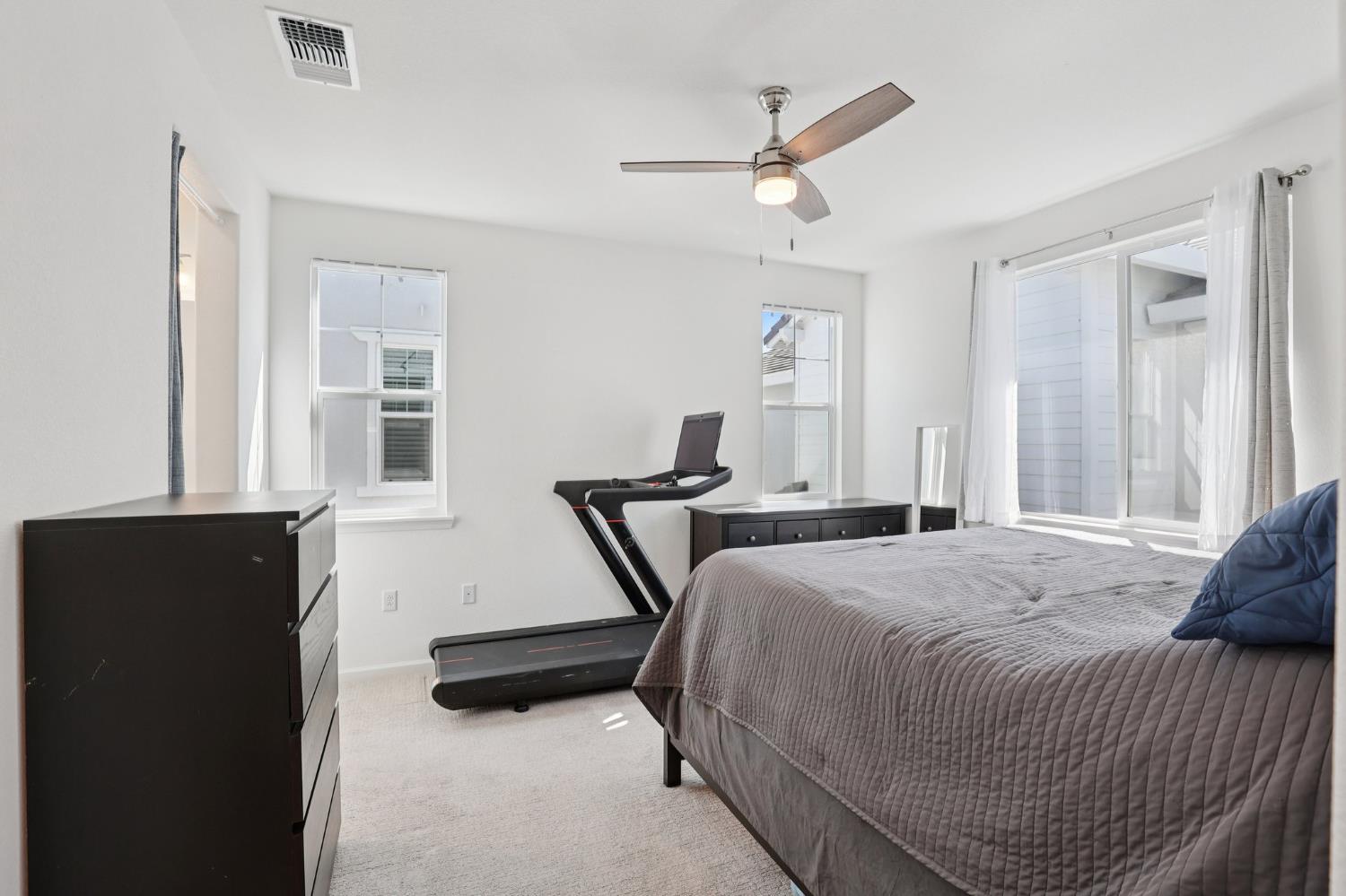 2413 Seaside Road Lathrop, CA 95330 - Photo 24 of 37 a bedroom with a bed and a window