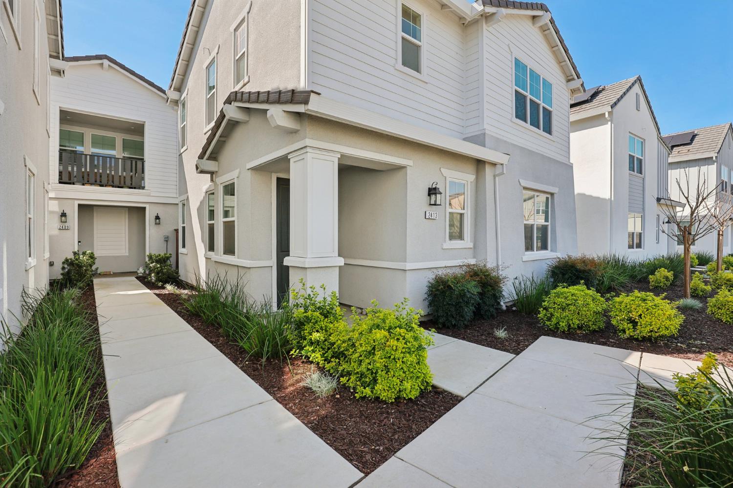 2413 Seaside Road Lathrop, CA 95330 - Photo 3 of 37 a front view of a house with garden