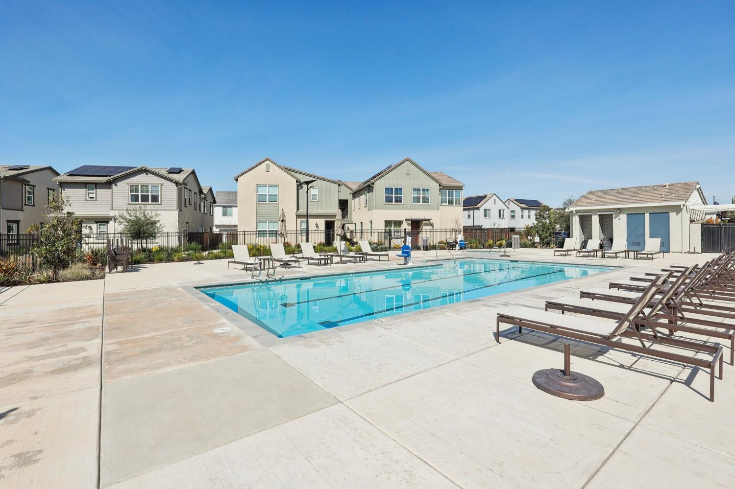 2413 Seaside Road Lathrop, CA 95330 - Photo 33 of 37 a view of swimming pool with outdoor seating and house in the background