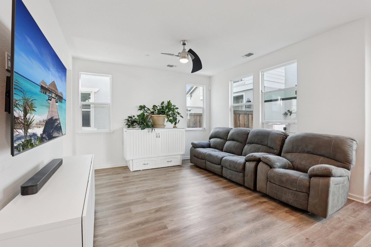 2413 Seaside Road Lathrop, CA 95330 - Photo 6 of 37 a living room with furniture and wooden floor