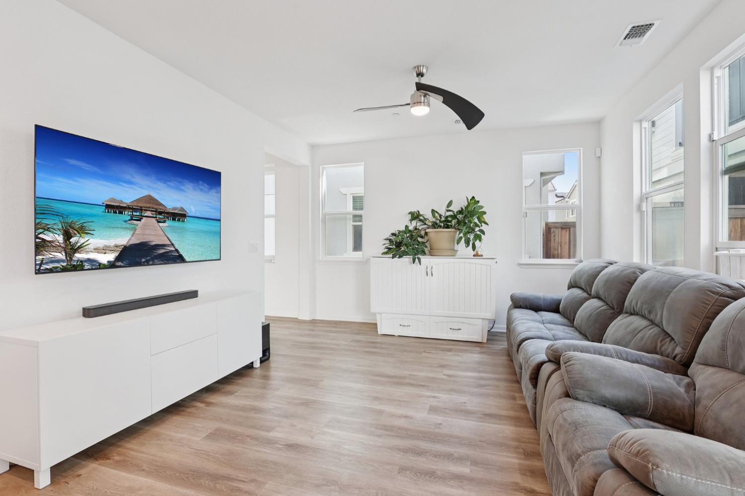 2413 Seaside Road Lathrop, CA 95330 - Photo 7 of 37 a living room with furniture and wooden floor