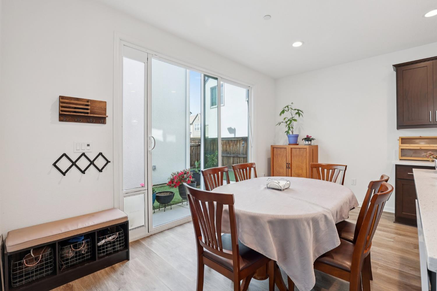 2413 Seaside Road Lathrop, CA 95330 - Photo 8 of 37 a view of a dining room with furniture window and wooden floor