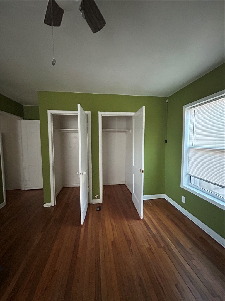 1041 East 5th Street Alice, TX 78332 - Photo 14 of 19 an empty room with wooden floor and closet