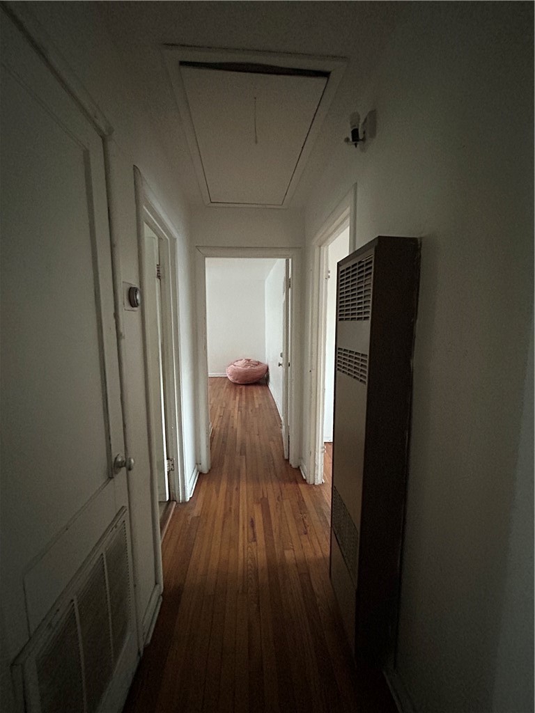1041 East 5th Street Alice, TX 78332 - Photo 15 of 19 a view of a hallway with wooden floor and staircase