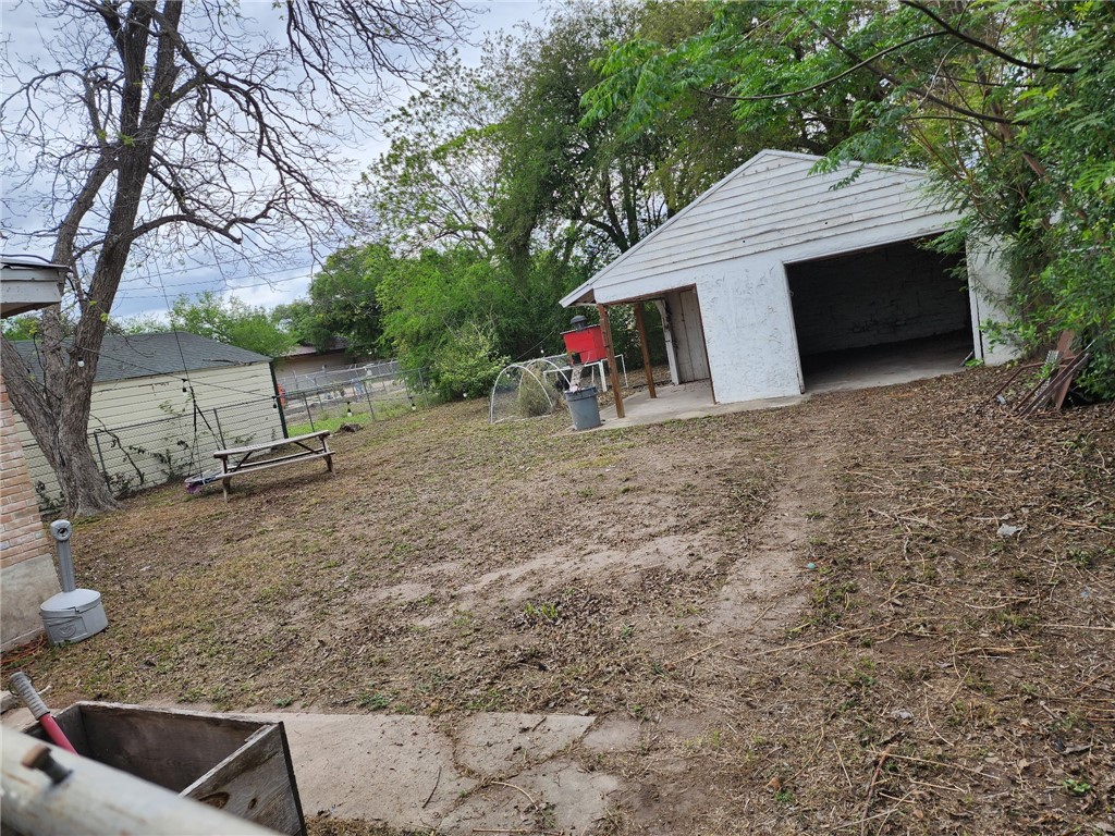1041 East 5th Street Alice, TX 78332 - Photo 19 of 19 a view of a barn in the backyard of house