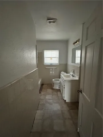 a view of a room with window and bathroom