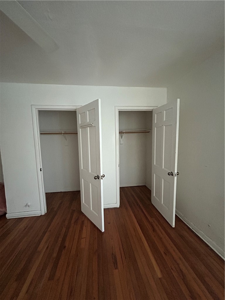 1041 East 5th Street Alice, TX 78332 - Photo 10 of 19 an empty room with wooden floor and closet
