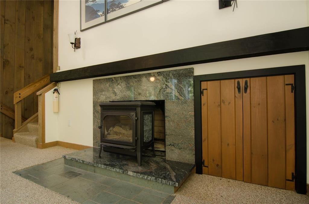 65 Andersen Road Raymond, ME 04071 - Photo 14 of 35 Living Room with wood stove.
