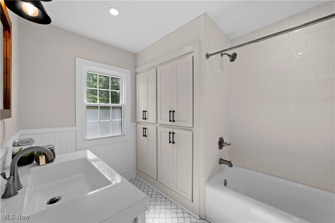 3725 Sutherland Road Shaker Heights, OH 44122 - Photo 11 of 24 Bathroom featuring wainscoting, shower / bath combination, recessed lighting, and vanity