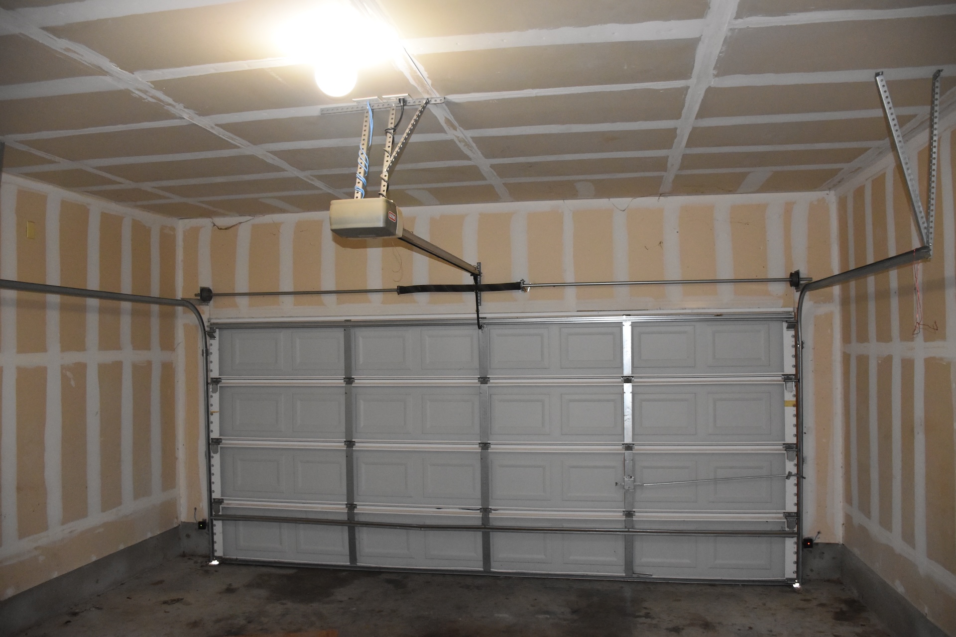 11300 Dimmit Street Manor, TX 78653 - Photo 20 of 23 A well-lit garage features a functional garage door opener for convenient vehicle access.