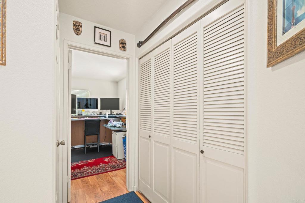 430 Stoney Point Way, Unit 129 Oceanside, CA 92058 - Photo 21 of 38 a view of a bedroom with a workspace