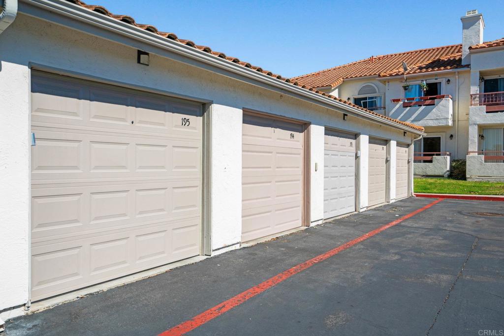 430 Stoney Point Way, Unit 129 Oceanside, CA 92058 - Photo 26 of 40 a view of house with garage and plants